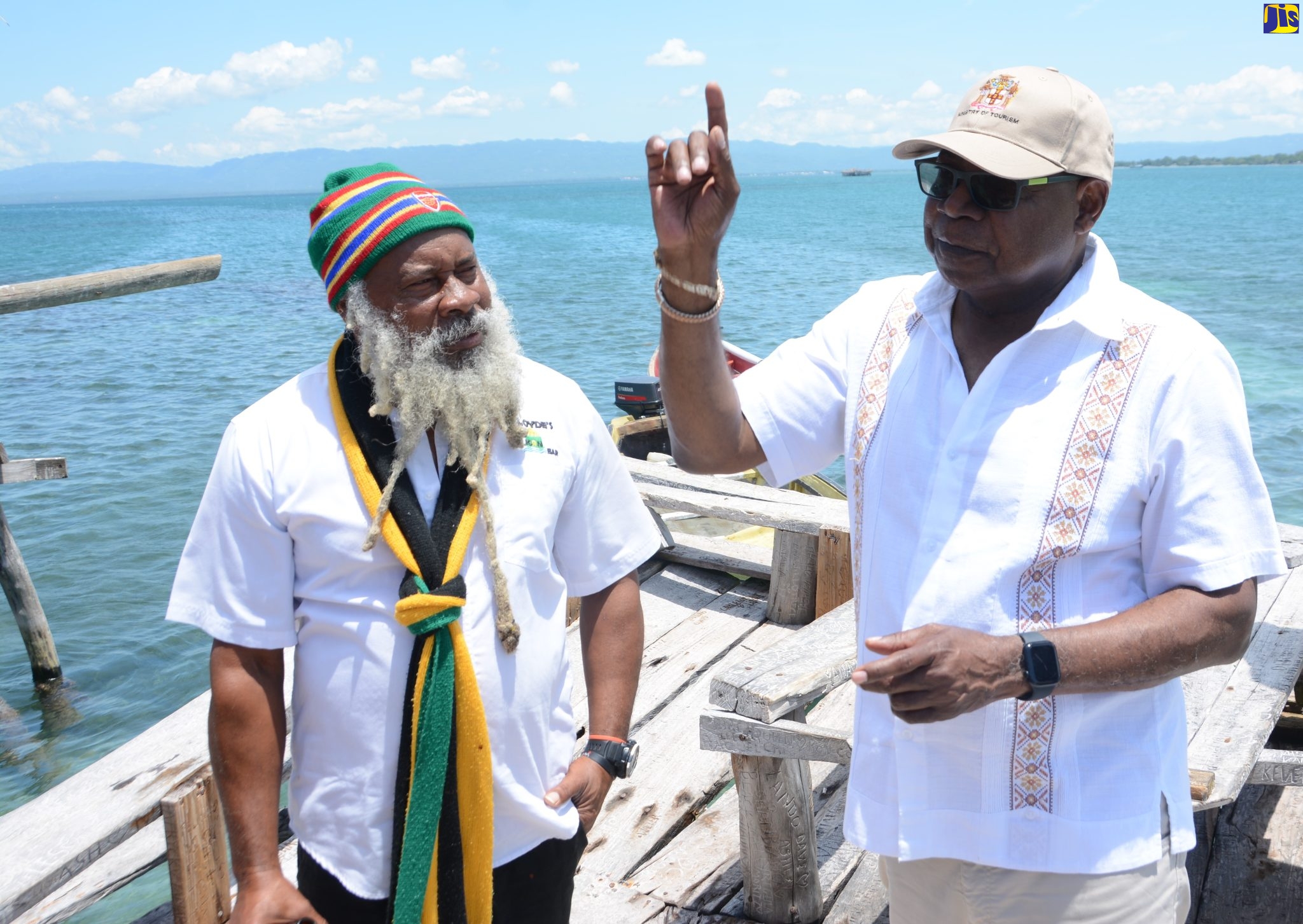 Tourism Minister, Hon. Edmund Bartlett (right), converses with the owner of Floyd’s Pelican Bar in St. Elizabeth, Delroy Forbes, during a Destination Assurance tour visit to the attraction on April 28.  
