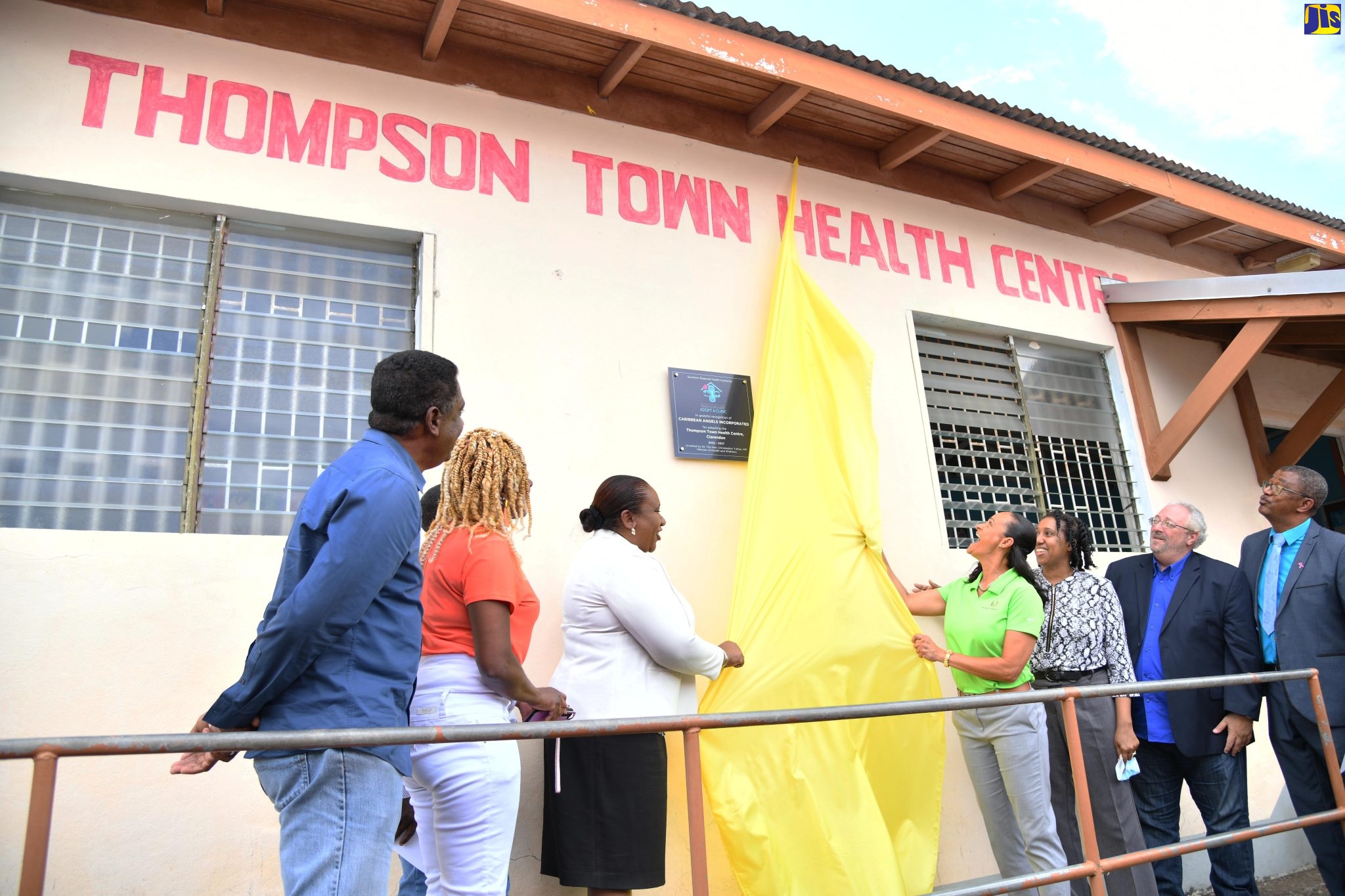 Undersecretary for the Diaspora, Protocol and Consular Affairs in the Ministry of Foreign Affairs and Foreign Trade, Marsha Coore Lobban (third left) and Executive Director of Caribbean Angels Inc, Angel Barrett (fourth right), unveil the plaque for the adoption of the Thompson Town Health Centre in Clarendon by Caribbean Inc on April 28.  Sharing in the occasion (from left) are Executive Director of the Ministry of Health and Wellness’ Health for Life and Wellness Foundation, Courtney Cephas; board member of Caribbean Angels Inc, Donna Thompson Forbes; Medical Officer of Health for the parish of Clarendon, Dr. Kimberly Scarlett-Campbell; Member of Parliament for Clarendon North Western, Phillip Henriques and Parish Manager for Clarendon Health Services, Joseph Grant.