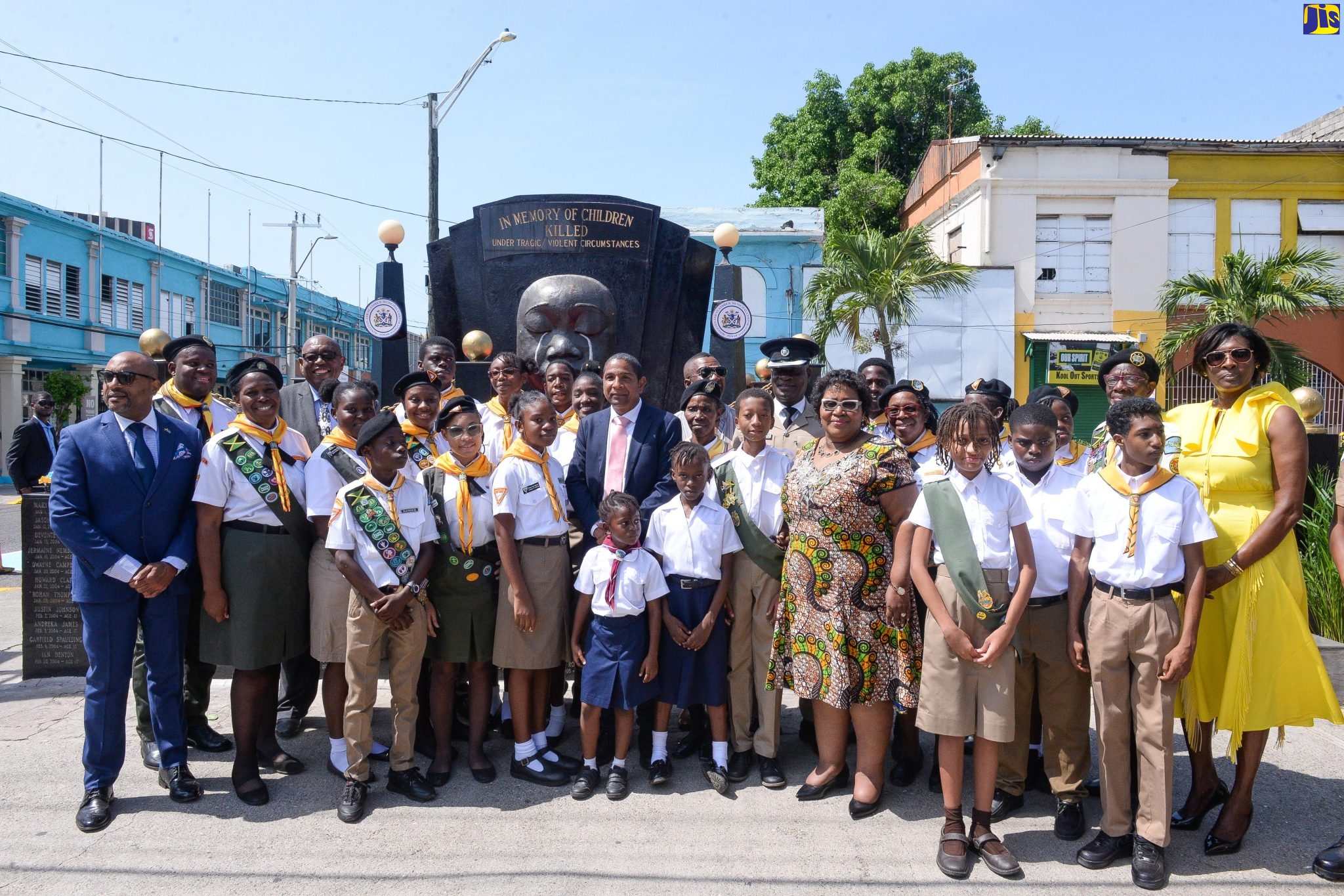 Mayor of Kingston, Senator Councillor Delroy Williams (centre), and Acting Chief Executive Officer of the Child Protection and Family Services Agency, Michelle McIntosh Harvey (fourth right), with the uniformed groups at a wreath laying ceremony held in memory of the nation’s children who have died under tragic/violent circumstances. The ceremony was held at the Secret Gardens Monument at the intersection of Tower and Church streets in downtown Kingston on Sunday (May 7).