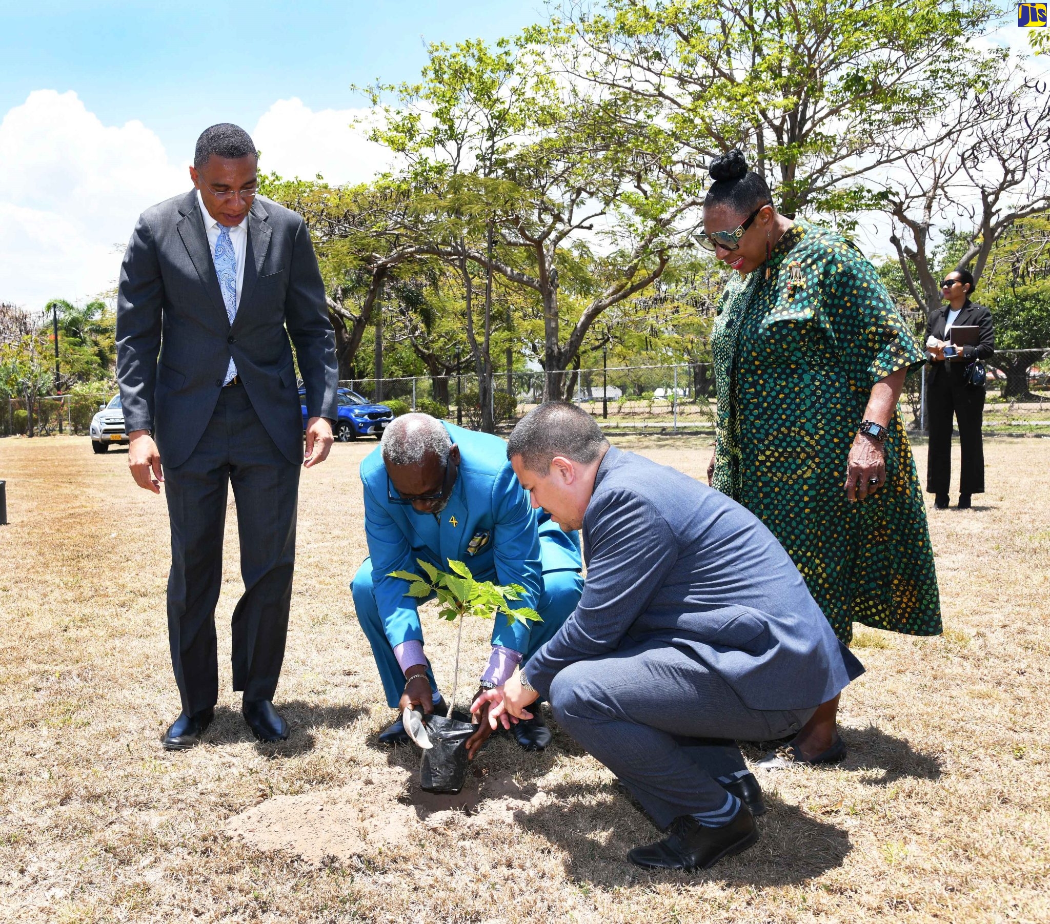 Prime Minister, the Most Hon. Andrew Holness (left) and (from left) Minister of Local Government and Rural Development, Hon. Desmond McKenzie; Minister without Portfolio in the Ministry of Economic Growth and Job Creation, Senator the Hon. Matthew Samuda and Minister of Culture, Gender, Entertainment and Sport, Hon. Olivia Grange, engage in a tree-planting exercise on the lawns of Jamaica House on Tuesday (May 2). Occasion was the launch of Labour Day and Workers’ Week, 2023, which will be observed under the theme ‘Plant a Tree for Life – Promoting Climate Change Mitigation, Food Security and Road Safety’.