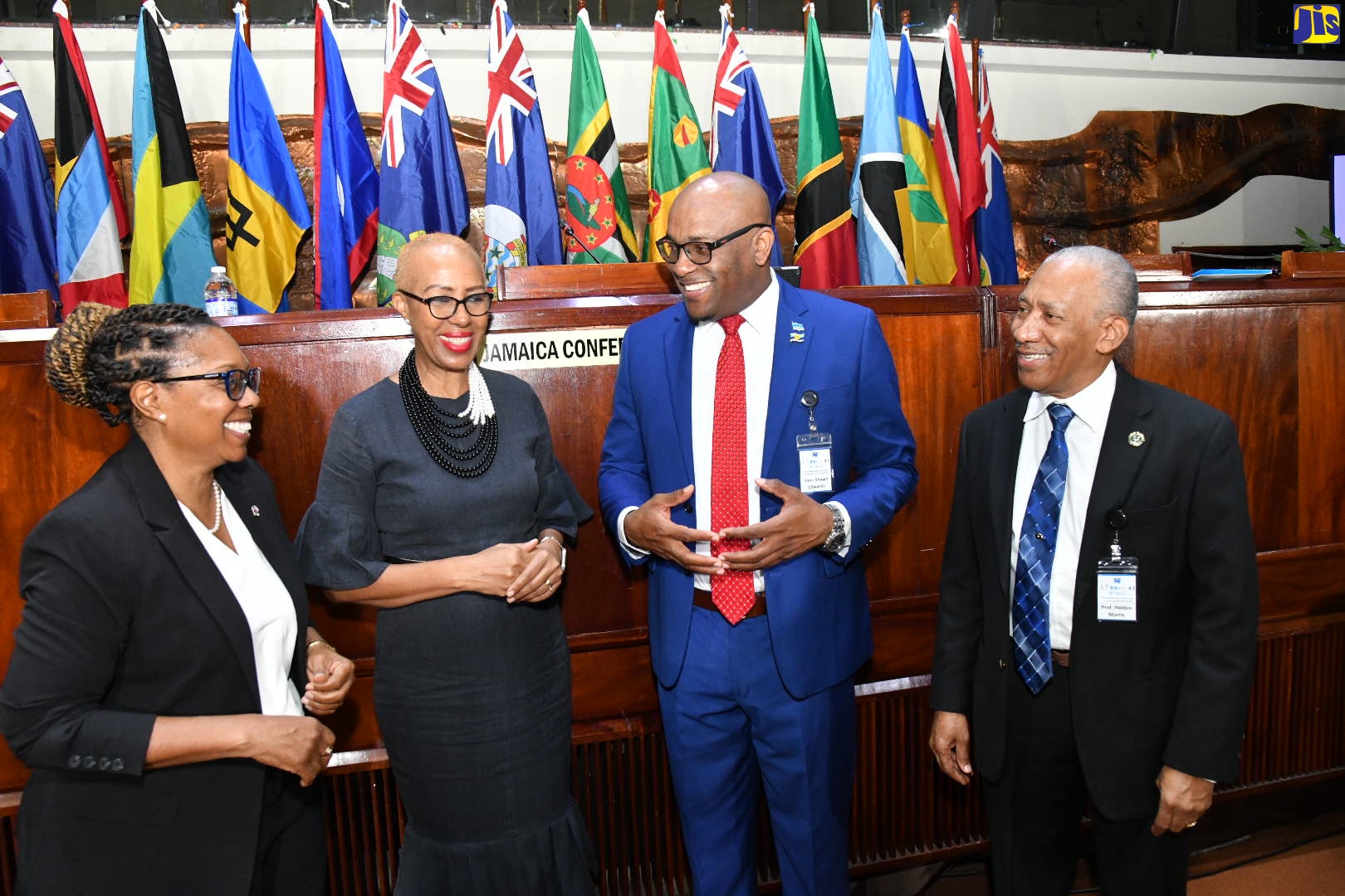 Minister of Education and Youth, Hon. Fayval Williams (second left), shares in light discussion with (from left) Director of the University of the West Indies (UWI) School of Education, Dr. Marcia Rainford; St. Lucia’s Minister of Education, Sustainable Development, Innovation, Science, Technology and Vocational Training, Shawn Edward and Founder of the International Conference on Technical and Vocational Education and Training  (TVET) in the Caribbean, Professor Halden Morris. Occasion was the sixth staging of the conference held recently at the Jamaica Conference Centre, downtown Kingston.