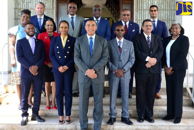 Prime Minister, the Most Hon. Andrew Holness (foreground), with members of the Constitutional Reform Committee (CRC) at Jamaica House in St. Andrew on March 22. Minister of Legal and Constitutional Affairs, Hon. Marlene Malahoo Forte (second left) and Ambassador Rocky Meade (third right), are co-chairs of the Committee.