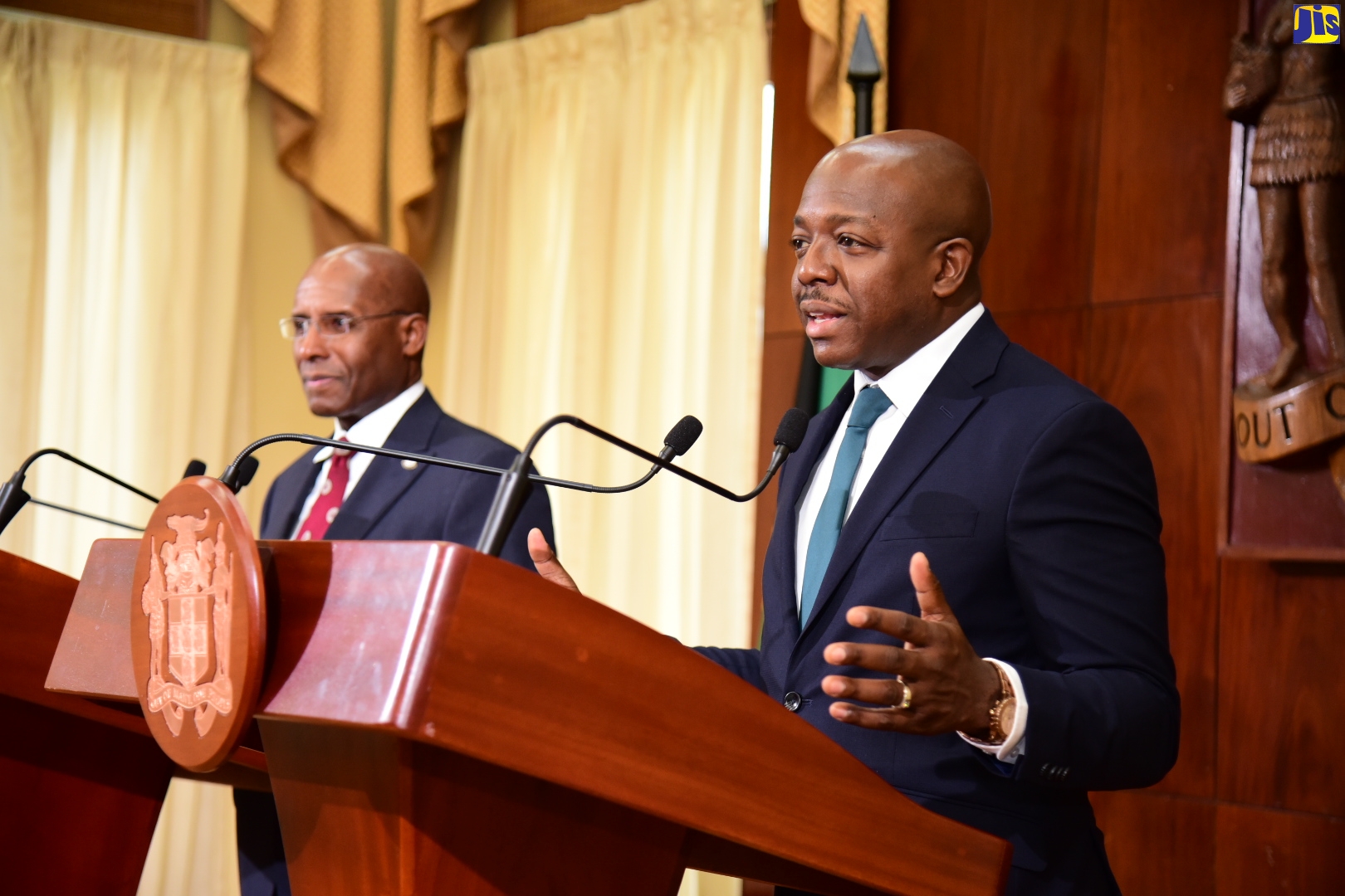 Minister of Labour and Social Security, Hon. Pearnel Charles Jr. (right), addresses today’s (June 21) post-Cabinet press briefing at Jamaica House, in St. Andrew. Listening at left is Minister of Industry, Investment and Commerce, Senator the Hon. Aubyn Hill.