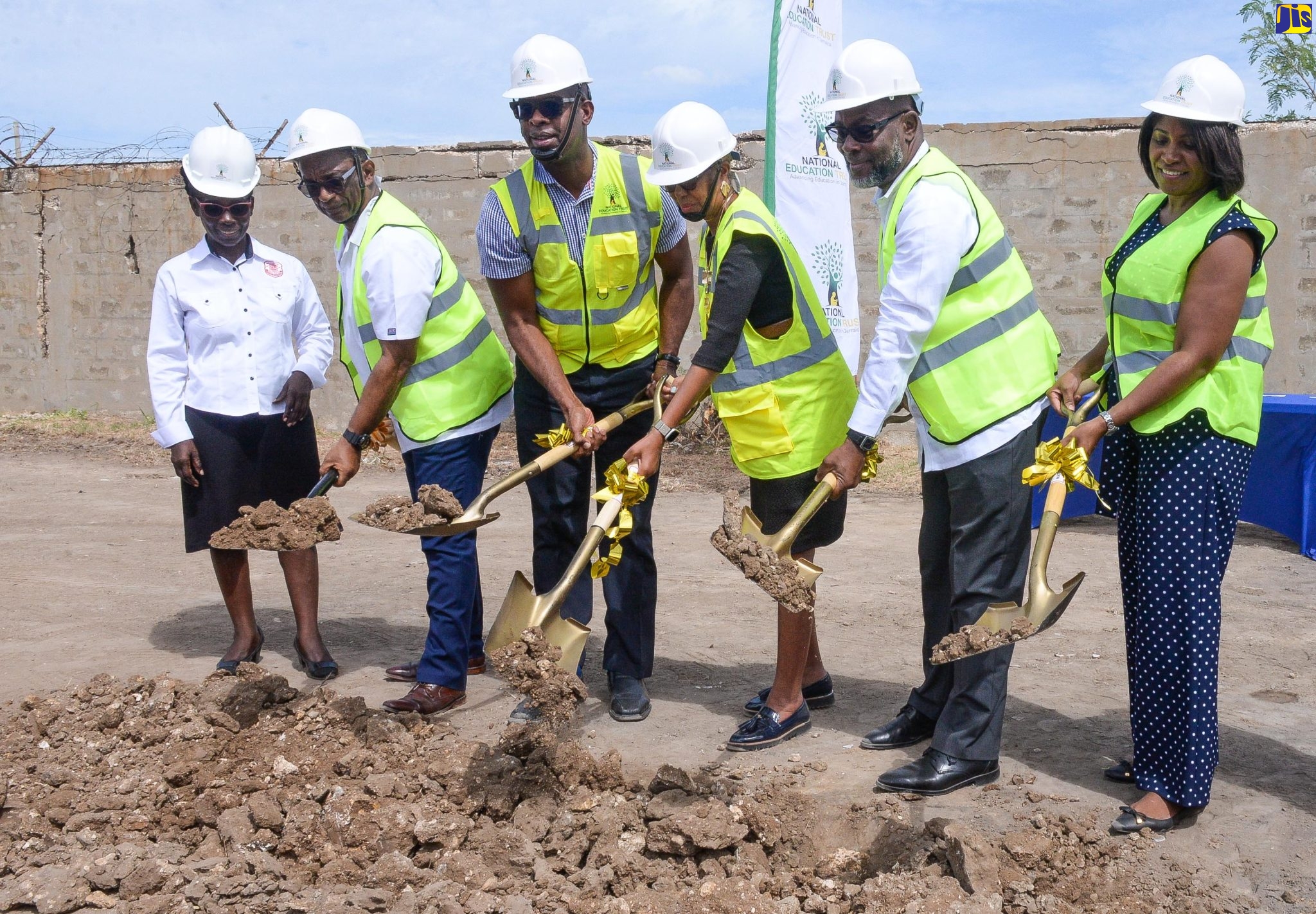 Minister of Education and Youth, Hon. Fayval Williams (third right), breaks ground along with other stakeholders for the expansion of the Bridgeport High School in Portmore, St. Catherine, on Tuesday (June 20). Others (from left) are Bridgeport High’s Principal, Beverley Harris, and Board Chairman, Dane Levy; Member of Parliament, St. Catherine Southeast, Robert Miller; Mayor of Portmore, Councillor Leon Thomas, and Executive Director, National Education Trust (NET), Latoya Harris-Ghartey.