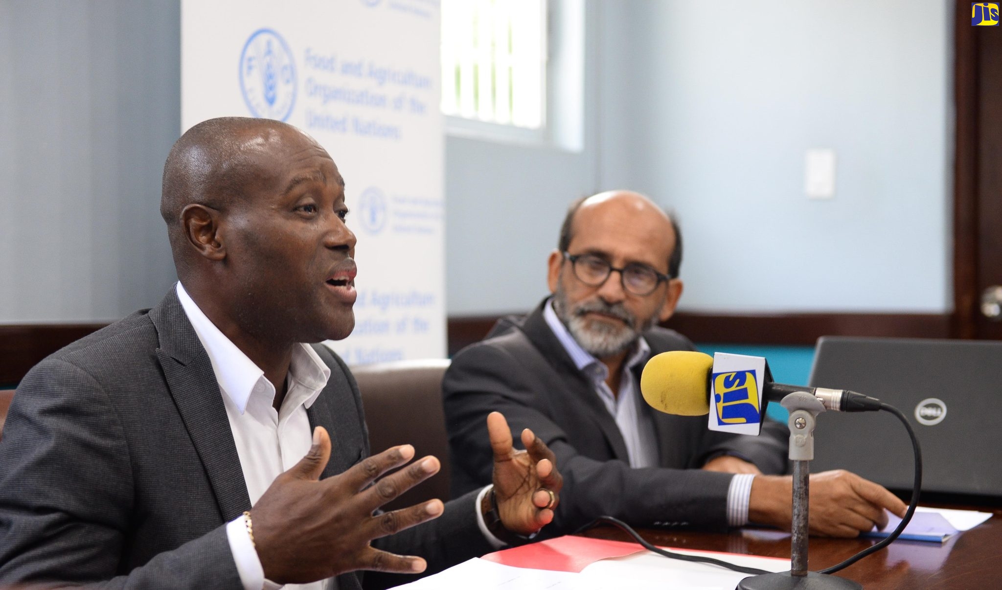 Chief Technical Director, Ministry of Agriculture, Fisheries and Mining, Courtney Cole, addresses stakeholders participating in a food-loss and waste-reduction technical workshop at the Ministry’s Hope Gardens offices in St. Andrew on June 8. At right is the Food and Agriculture Organization of the United Nations (FAO) Representative for Jamaica, The Bahamas, and Belize, Dr. Crispim Moreira.