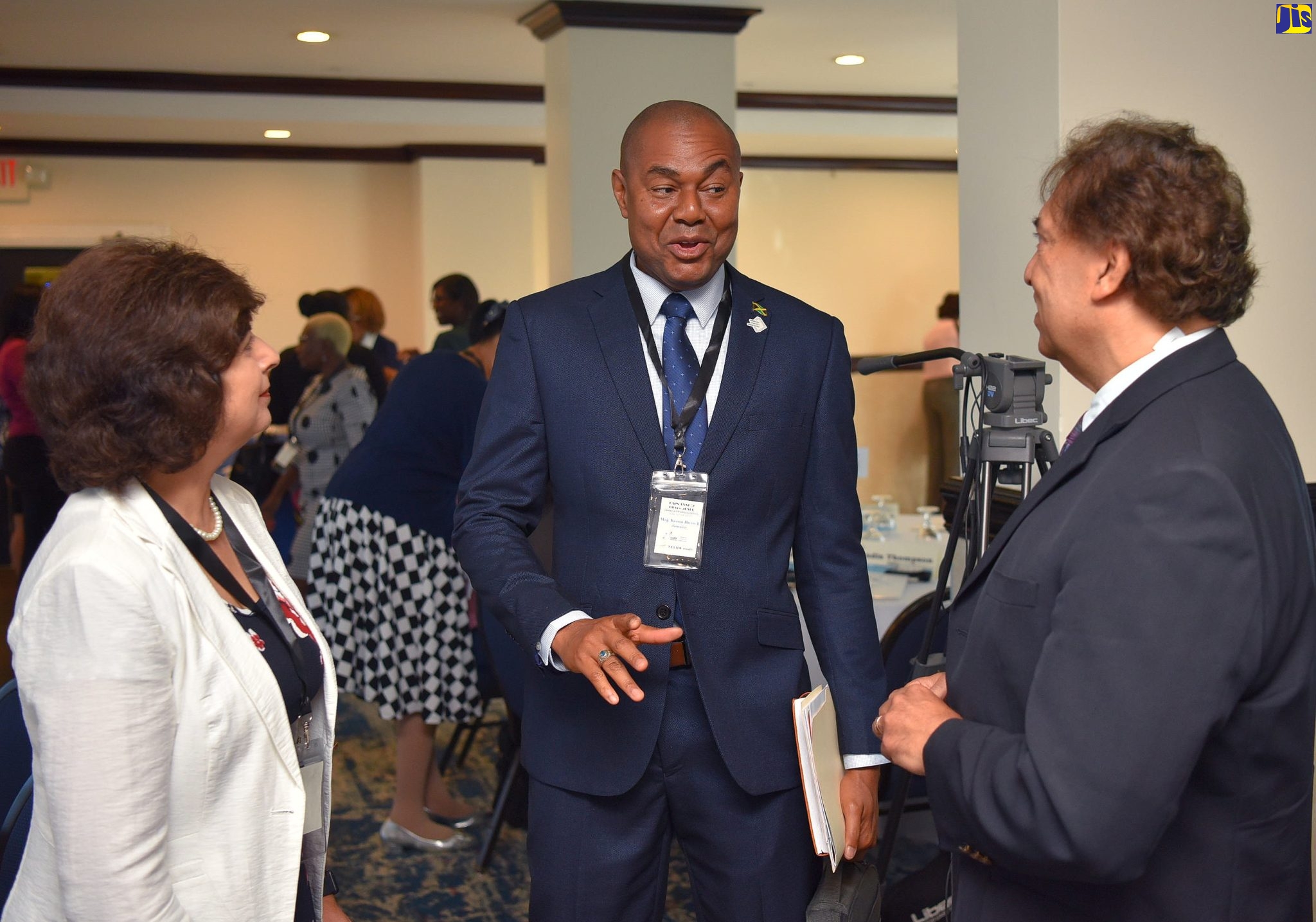 Executive Director, Financial Services Commission (FSC), Major Keron Burrell (centre), converses with (from left) Senior Programmes Director, Toronto Centre, Shelina Visram and Senior Partner, TELUS Health, Al Kiel. Occasion was the opening ceremony for the Caribbean Association of Pensions Supervisors (CAPS) Conference at The Jamaica Pegasus hotel in New Kingston on Tuesday (June 13). 
