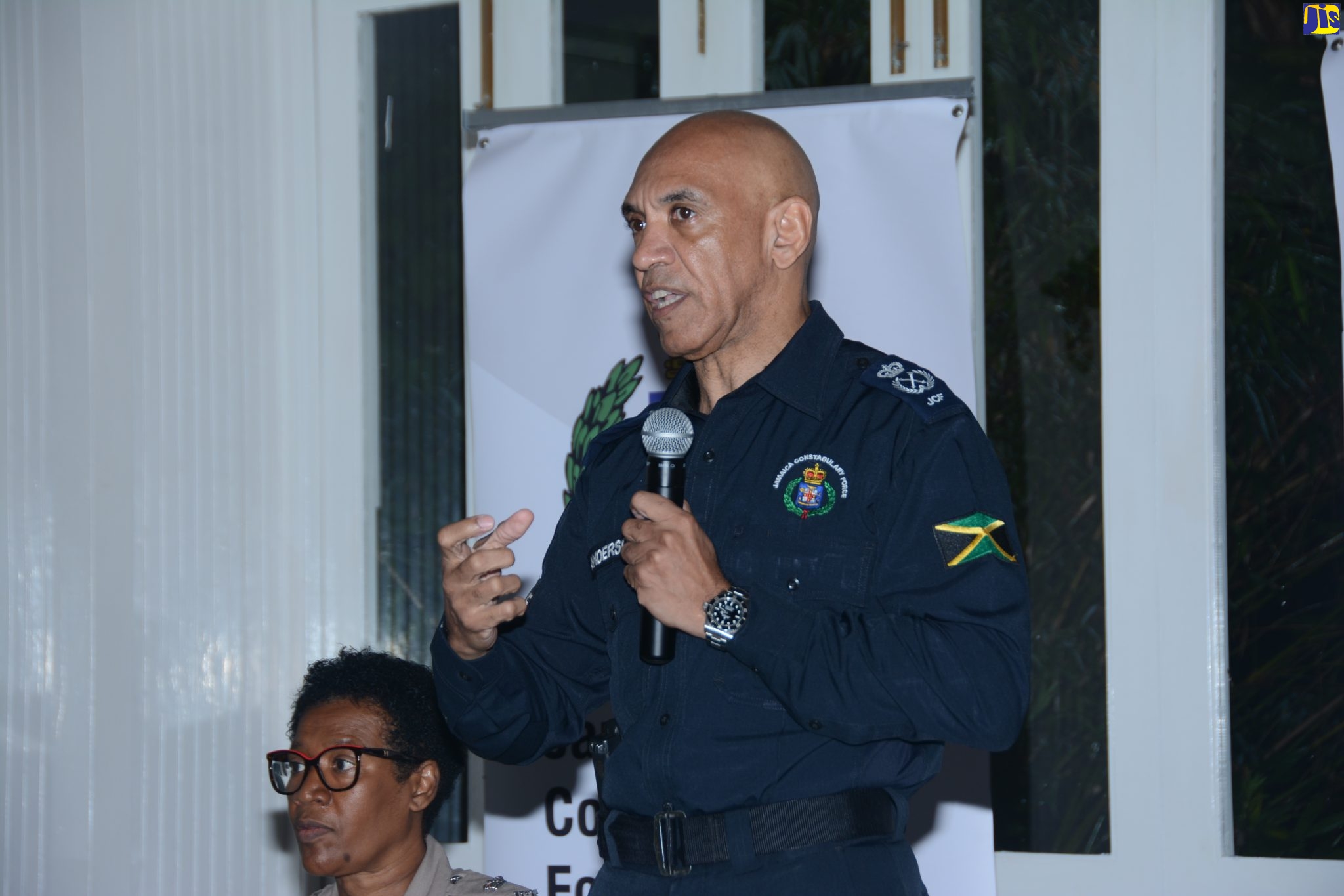Commissioner of Police, Major General Antony Anderson, addresses a meeting with stakeholder groups in Hanover at Round Hill Hotel and Villas in the parish on Tuesday (June 6). Seated (at left) is Commanding Officer for Hanover, Superintendent Sharon Beeput.