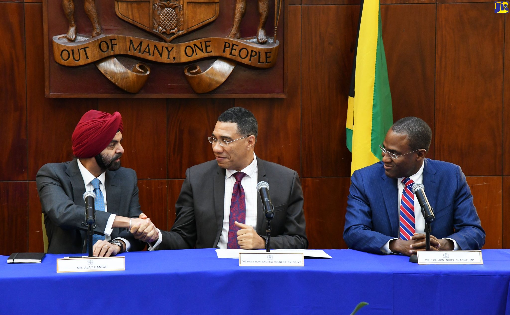 Prime Minister, the Most Hon. Andrew Holness (centre), shakes hands with World Bank President, Ajay Banga (left), during a meeting at Jamaica House on Wednesday (June 14). At right is Minister of Finance and the Public Service, Dr. the Hon. Nigel Clarke.
