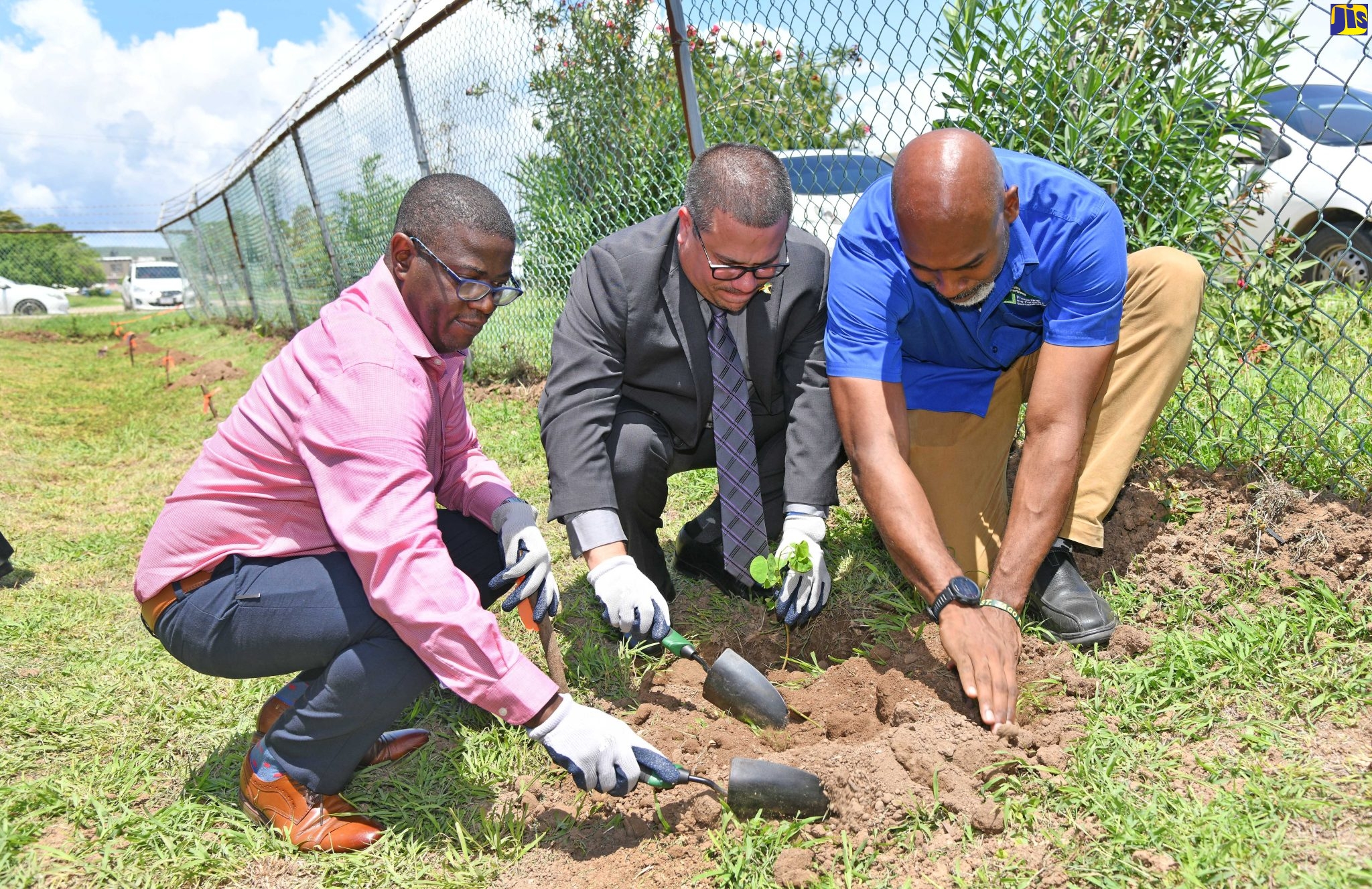 Minister without Portfolio in the Ministry of Economic Growth and Job Creation, Senator the Hon. Matthew Samuda (centre), plants a Poor Man’s Orchid sapling, during the National Health Fund (NHF) Tree-Planting Initiative launch ceremony at the Drug Serv Greater Portmore Health Centre in St. Catherine, on June 6. Assisting (from left) are NHF Chief Executive Officer (CEO), Everton Anderson and Conservator of Forests and Forestry Department CEO, Ainsley Henry. The NHF is coordinating the planting of 20,000 trees islandwide as part of celebrations marking its 20th anniversary, under the theme ‘Reigniting the Health Financing Agenda’. This initiative is part of the NHF’s Corporate Social Responsibility to promote environmental sustainability and underscores its commitment to a greener future for succeeding generations.