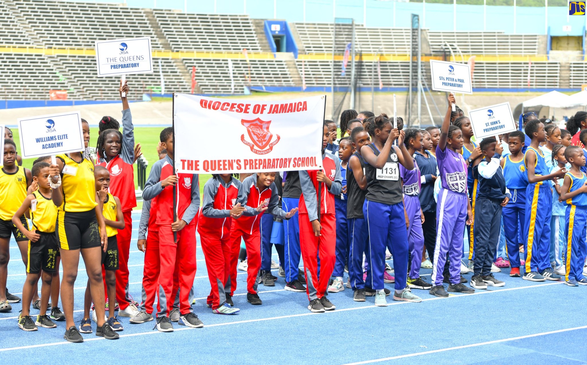 Students of various preparatory schools display their institutions’ banners during the opening ceremony for the Jamaica Independent Schools’ Association (JISA) National Preparatory Schools Track and Field Championships, held recently at the National Stadium in Kingston. 