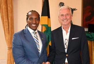 Minister of State in the Ministry of Foreign Affairs and Foreign Trade, Hon. Alando Terrelonge (left), greets Chief Executive Officer of Bamboo Bioproducts, David Stedeford, at a recent meeting with business interests in the United Kingdom (UK), at the Jamaican High Commission in London.