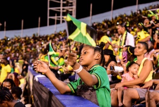 A little girl waves her Jamaican flag, during the Independence Day Grand Gala, held on August 6, at the National Stadium, in St. Andrew.