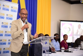 Director of the Meteorological Service of Jamaica, Evan Thompson addresses the closing ceremony for a Proposal Writing Workshop for Non-Governmental and Civil Society Organizations in the Caribbean, held on Friday, August 11 at the Jamaica Pegasus Hotel in New Kingston.