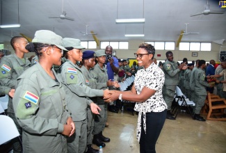 Minister of State in the Ministry of National Security, Hon. Juliet Cuthbert-Flynn, greets overseas representatives attending Sunday’s (July 16) opening ceremony for this year’s renewal of the Caribbean Cadet Camp at Clarendon College. Mrs. Cuthbert-Flynn was the keynote speaker. Approximately 800 cadets from 14 regional countries are attending the event, which is being staged by the Caribbean Cadet Association from July 15 to 29 under the theme ‘Empowering Cadets, Tomorrow’s Leaders’.