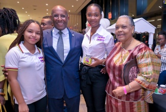 Minister of Industry, Investment and Commerce, Senator the Hon. Aubyn Hill (second left), with (from left) Representatives from Pickle mi Pickle, April Lyn and Janelle Wilkinson, and Chief Executive Officer, Jamaica Business Development Corporation (JBDC), Valerie Veira, at the Suga Lifestyle’s Micro, Small and Medium-sized Enterprise (MSME) Empowerment Art and Lifestyle Expo Launch, held on August 18 at the AC Hotel by Marriot Kingston. The Expo seeks to promote local businesses and entrepreneurs, with a focus on the MSME sector. It will also highlight the critical role of women and their contribution to this sector, which remains vital to the Jamaican economy.