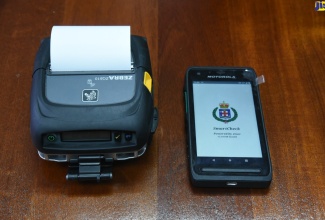 The smart device and portable printer that is used by members of the Jamaica Constabulary Force (JCF) to issue traffic tickets.