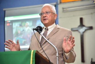 Minister of Justice, Hon. Delroy Chuck, delivers remarks during a symposium organised by the Jamaica Council of Churches, entitled ‘Pursing Peace, Affirming Human Dignity’. The forum was held at the United Theological College of the West Indies in Kingston, on Thursday, November 17, 2022.