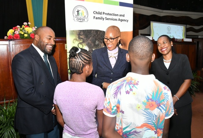 Minister of Education and Youth, Hon. Fayval Williams (centre), congratulates wards of the State on emerging as top performers in the 2023 Primary Exit Profile (PEP) examinations. Sharing in the celebration are State Minister in the Ministry of Education and Youth, Hon. Marsha Smith (right), and Child Protection and Family Services Agency (CPFSA) Director of Programmes, Dr. Warren Thompson (left). The occasion was the CPFSA PEP Workshop and Awards Ceremony at the Jamaica Conference Centre in downtown Kingston on Wednesday (August 16).
