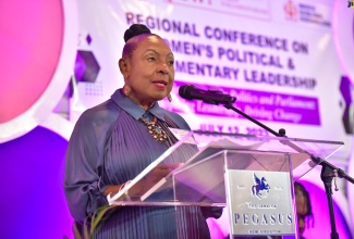 Minister of Culture, Gender, Entertainment and Sport, Hon. Olivia Grange, addresses a regional conference on women’s political and parliamentary leadership, at The Jamaica Pegasus hotel in New Kingston, on Wednesday (July 12).