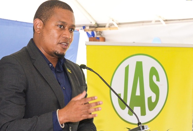Minister of Agriculture, Fisheries and Mining, Hon. Floyd Green, addresses the launch of the Denbigh Agricultural, Industrial and Food Show today (June 21), at the Hi-Pro supercentre in St. Catherine.