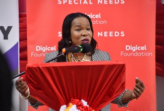 Acting Chief Education Officer at the Ministry of Education and Youth, Dr. Kasan Troupe, brings greetings during the official opening of the Santa Cruz Special Education Centre in St. Elizabeth, recently.