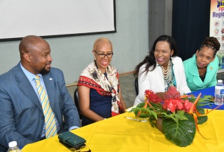 Minister of Education and Youth, Hon. Fayval Williams (second left), enjoys a light moment with (from left) Registrar at the University of the West Indies, Mona Campus, Dr. Maurice Smith, Acting Chief Education Officer, Dr. Kasan Troupe, and Regional Director with the Ministry, Dasmine Kennedy. Occasion was a back-to-school conference held on July 28, at Jamaica College in Kingston.