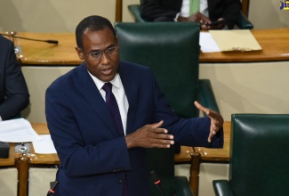 Minister of Finance and the Public Service, Dr. the Hon. Nigel Clarke, addresses the House of Representatives on Tuesday (July 4).