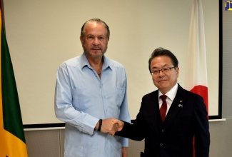 President of the Senate, Hon. Thomas Tavares-Finson (left), greets Secretary-General for the Liberal Democratic Party in the House of Councillors of Japan, Seko Hiroshige, during a meeting held at the Ministry of Foreign Affairs and Foreign Trade in downtown Kingston, on August 8. The meeting was held with the Japan-CARICOM Parliamentary Friendship League.