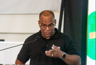 Inter-American Development Bank (IDB) Senior Specialist for Climate Change, Gerard Alleng, delivers remarks during the recent launch of the Ministry of Industry, Investment and Commerce’s MSME Business Roadshow at the Golf View Hotel in Mandeville, Manchester.