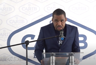 Quality Manager at the CARIB Brewery, St. Kitts and Nevis, Desroy Tate, delivers remarks at a handover ceremony where the brewery received certification to the International Organization for Standardization (ISO) 22000:2018 standard for food safety management systems. The ceremony was held on the company’s ground on Friday, July 14.