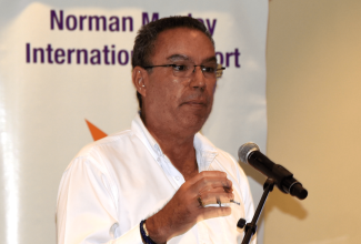 Minister of Science, Energy, Telecommunications and Transport, Hon. Daryl Vaz, addresses the PAC Kingston Airport Limited NMIA Airport Forum on Friday (August 25) at the Jamaica Pegasus Hotel in New Kingston.