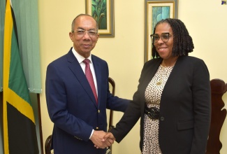 Minister of National Security, Hon. Dr. Horace Chang, greets Jamaica