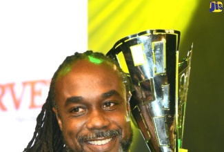 2023 Festival Song winner ‘Slashe’ shows off his trophy after taking victory for his original entry, ‘Best in the World’, in the finals of the Jamaica Cultural Development Commission (JCDC)-organised competition held on July 29 at the National Arena in Kingston.