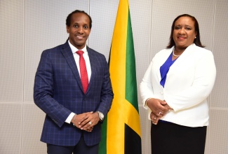 Minister of State in the Ministry of Foreign Affairs and Foreign Trade, Hon. Alando Terrelonge (right), shares a photo opportunity with High Commissioner-designate to Canada, Marsha Coore-Lobban, during a courtesy call at the Ministry’s offices in downtown Kingston on Tuesday (August 29). Mrs. Coore-Lobban is a career diplomat with more than 26 years in the Jamaican Foreign Service. She currently serves as Acting Under Secretary for Diaspora, Consular and Protocol Affairs. Her previous overseas appointments included Deputy Consul General in Miami, Chargé d’Affaires at the Jamaican Embassy in Brazil, and Deputy Chief of Mission at the Jamaican Embassy in Washington DC.