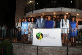 Jamaica’s Ambassador to the United States, Audrey Marks (front, right) and Chairman of the Jamaica Howard University Affinity Network (JHUAN), Don Christian (front, left), are surrounded by Jamaican students attending Howard University, who have been awarded scholarships totalling US$80,000 by JHUAN. The award ceremony was held recently at the Ambassador’s residence in Maryland.