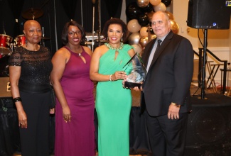 Jamaica’s Ambassador to the United States, Her Excellency Audrey Marks (second left) is presented with the Jamaican Organization of New Jersey (JON-J) Distinguished Award for Excellence in Leadership and Diplomacy by the entity’s President, Owen Eccles. Others (from left) are Dr Abigail Johnson and Northeast Diaspora Representative, Michelle Tulloch-Neil. The award was presented during the JON-J’s recent 25th anniversary gala and Jamaica 61st Independence anniversary celebrations at the Newark Airport Marriott Hotel in New Jersey.

