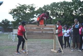 A youngster climbs a wall as part of an obstacle course race  during a ‘Sweat Fest’ at the University of Technology (UTech) campus in St. Andrew on Saturday (Sept. 9). The event was part of the Ministry of Health and Wellness’ Weekend of Wellness (WOW)’ to mark Caribbean Wellness Day on Friday (Sept. 8).