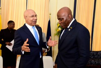 Governor-General, His Excellency the Most Hon. Sir Patrick Allen (left), converses with Chief Justice, Hon. Bryan Sykes, during Monday’s (September 18) swearing-in ceremony at King’s House for nine members of the judiciary who have been appointed to higher office.

