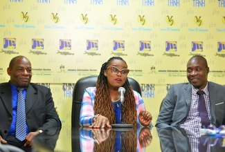 President of the Jamaica Civil Service Association (JCSA), Techa Clarke-Griffiths (centre), addresses a JIS Think Tank on September 8, where she highlighted activities for International Coastal Cleanup (ICC) Day on Saturday, September 16. She is flanked by First Vice President, Clarence Frater (left) and Second Vice President, Kelvin Thomas.
