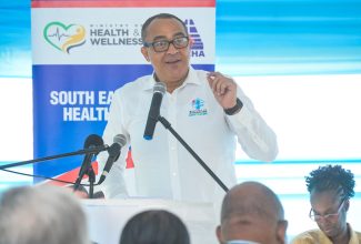 Health and Wellness Minister, Dr. the Hon. Christopher Tufton, addresses the official ceremony for the adoption of the Golden Spring Health Centre in St. Andrew, on September 8. The centre has been adopted by the Watson Family RalRosa Foundation for a period of three years under the Ministry’s ‘Adopt-A-Clinic’ programme.