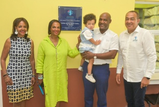 Minister of Health and Wellness, Dr. the Hon. Christopher Tufton (right), is pictured with Directors of the Watson Family RalRosa Foundation (from left) Kim Watson, Dr. Jacqueline Watson, and Richard Watson with son Edgar. Occasion was the official ceremony for the adoption of the Golden Spring Health Centre in St. Andrew on September 8. The facility has been adopted by the Foundation for a period of three years under the Ministry’s Adopt-A-Clinic Programme.