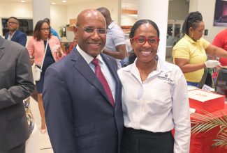 Minister of Industry, Investment and Commerce, Senator the Hon. Aubyn Hill (left), shares a moment with Chief Executive Officer, National Rums of Jamaica, Martha Miller. The event was the Jamaica Manufacturers and Exporters Association (JMEA) Manufacturing and Exporting (M&E) Awards 2023 Nomination event held on September 12 at the BMW Autobahn Showroom in Kingston.

