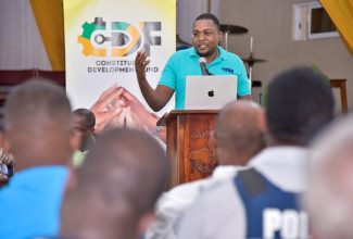 Member of Parliament for Clarendon North Central, Hon. Robert Morgan, emphasises a point, while addressing a Constituency Development Fund (CDF) consultation at Clarendon College on Thursday (September 14).