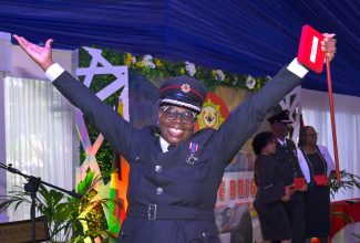 Assistant Commissioner, Jamaica Fire Brigade, Julian Davis-Buckle, celebrates after being presented with the 2022 Queen’s Platinum Jubilee Medal during a ceremony hosted by the JFB at the Terra Nova All-Suite Hotel in St. Andrew, recently. Mrs. Davis-buckle has given 27 years of service to the Brigade.
