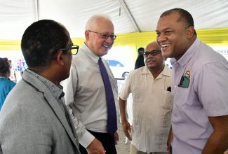 Minister of Justice, Hon. Delroy Chuck (second left), is in light conversation with (from left) State Minister in the Ministry of Local Government and Rural Development, Dr. the Hon. Norman Dunn; Custos Rotulorum of St. Mary, Errol Johnson; and Mayor of Port Maria, Richard Creary. The event was the Legal Aid Council (LAC) Justice Fair held on September 15 at the Annotto Bay Car Park, Main Street in St. Mary. The LAC Justice Fairs play an integral role in increasing access to justice services for Jamaicans.
