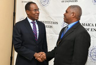 Minister of Finance and the Public Service, Dr. the Hon. Nigel Clarke (left), greets President, Jamaica Institution of Engineers (JIE), Godfrey Boyd, during the opening ceremony for Engineers’ Week, held at The Summit in New Kingston on Monday (September 18).

