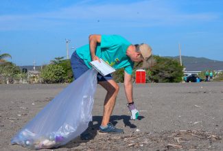 Deputy Head of Mission, Delegation of the European Union (EU) in Jamaica, Piotr Byzcowski, collects debris deposited along Foreshore Road in Port Royal on Saturday (September 16) as part of activities by representatives for International Coastal Cleanup Day. The day is observed annually on the third Saturday in September.