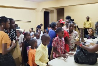 Students in line to receive their school supplies at the Dover Seventh-day Adventist Church in St. Catherine on Saturday (September 2).