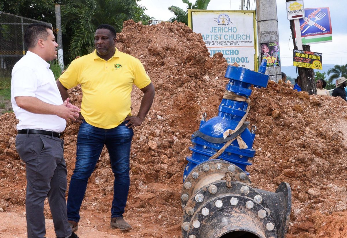 Minister without Portfolio in the Ministry of Economic Growth and Job Creation, Senator the Hon. Matthew Samuda (left), is in conversation with Councillor of the Treadways Division, Sydney Rose, during a tour of the Jericho Pipeline Project in St. Catherine on September 28. The project, which is part of a  0.8-kilometre road transformation, costing just over $125 million, delivers two million additional gallons of water daily to communities in Linstead, St. Catherine, and features a 16-inch main pipeline. The project began in July 2023 and is to be completed in December 2023.