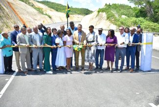 Prime Minister, the Most Hon. Andrew Holness (centre), and his wife, the Most Hon. Juliet Holness, are flanked by several Ministers of Government, representatives of China Harbour Engineering Company (CHEC), agency representatives and other interests during the official opening of the May Pen to Williamsfield leg of the Southern Coastal Highway Improvement Project. The highway was opened on Thursday (September 14).